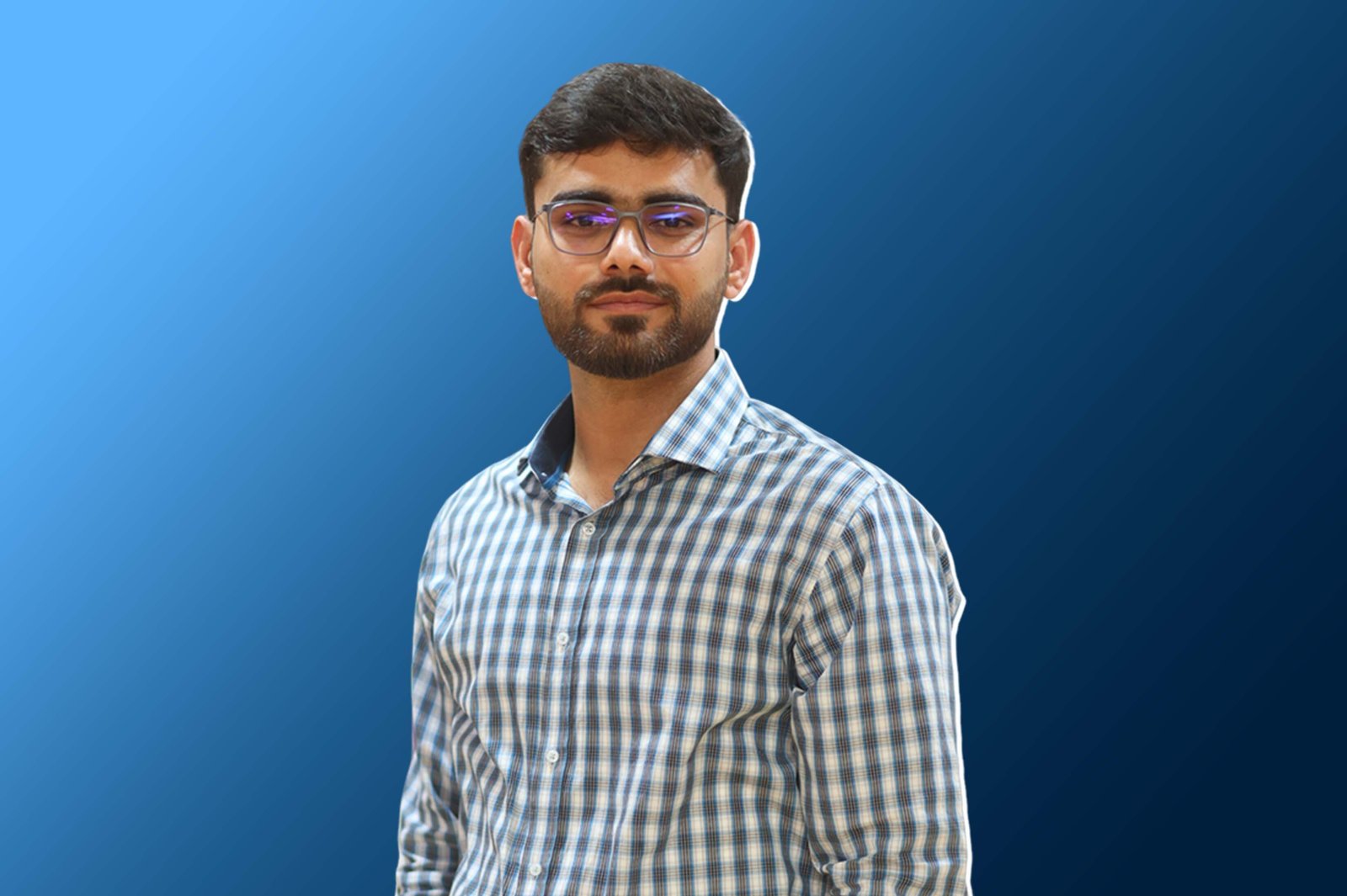 A professional portrait of Abdul Basit RK, a Full-Stack Web Developer, wearing a blue and white checkered shirt and glasses, posed against a clean blue gradient background.